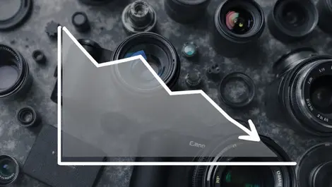 Downward trending line graph abstract camera lenses declining sales demand