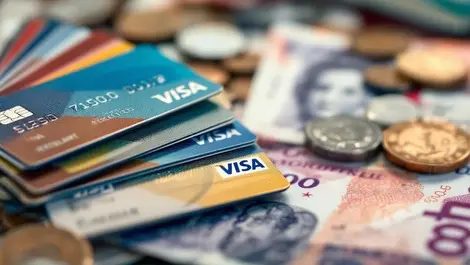 Uk credit cards coins british currency notes rising debt financial stress